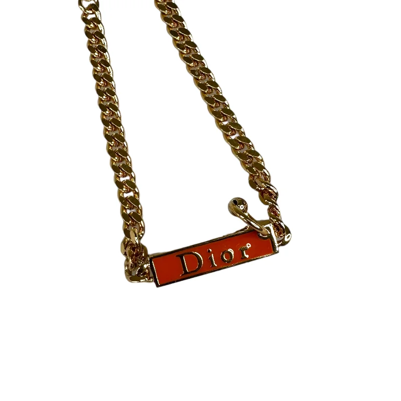 DIOR ORANGE ENAMEL SPELLOUT GOLD-PLATED BRACELET